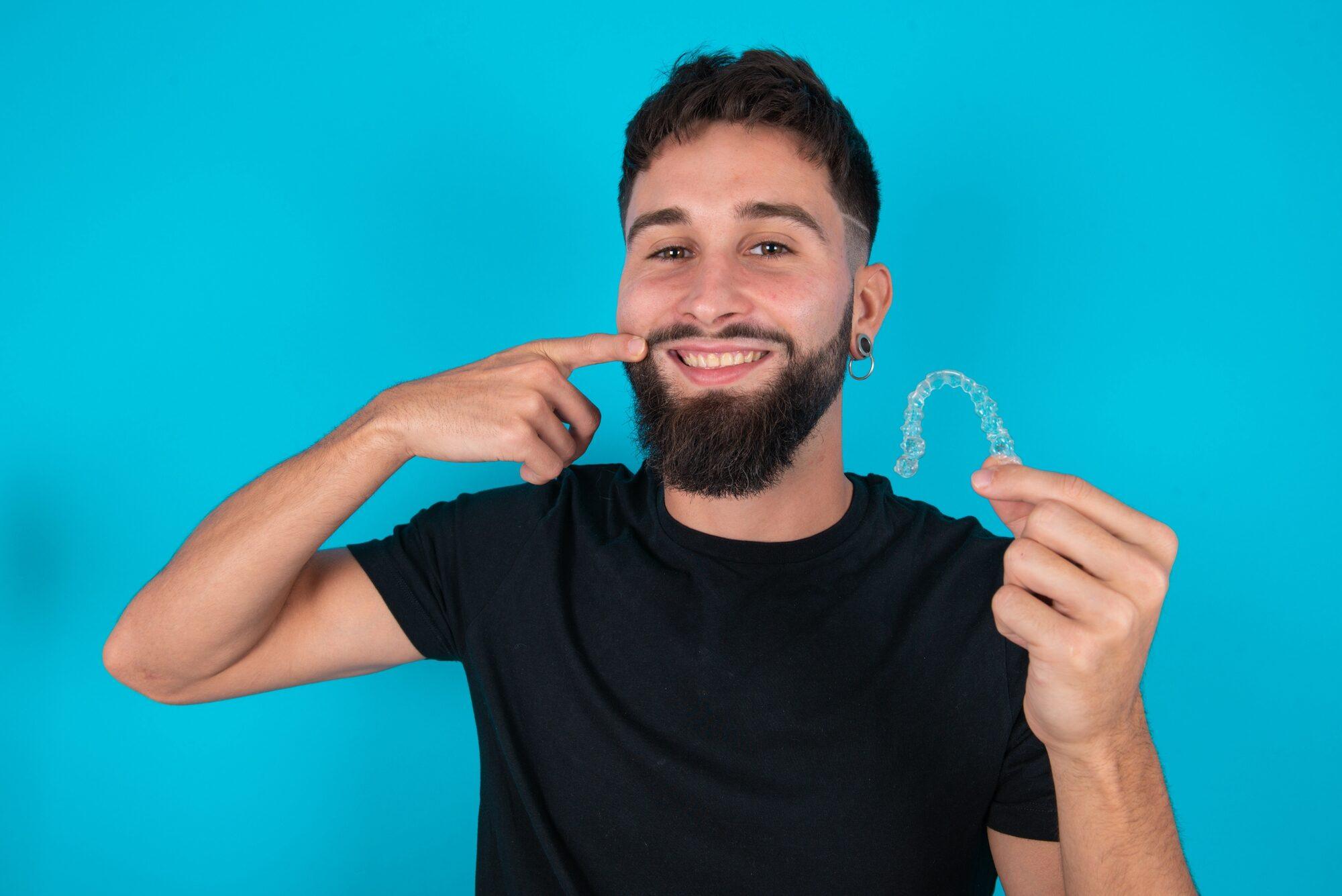 Patient holding a clear aligner
